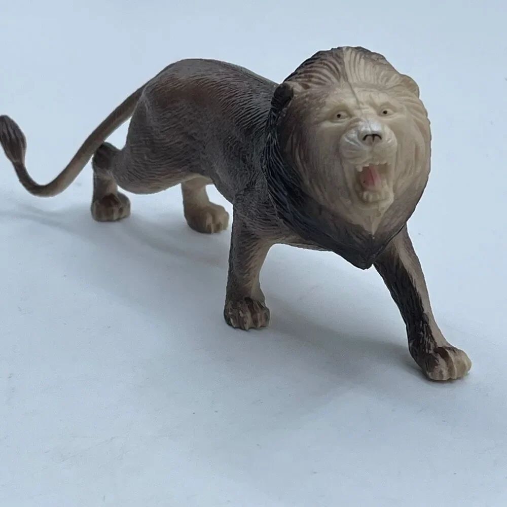 Vintage 1980’s/90’s hard rubber lion figure action toy.